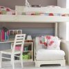 Fargo high sleeper loft bed with a curved corner desk and folded up futon bed, as well as a hook on shelf, ladder back chair and bookcase. Shown in Ivory White.