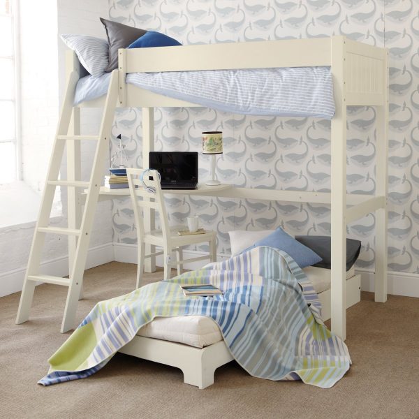 High sleeper loft bed in ivory white, with an unfolded futon with blankets and sleepover bedding. Corner desk set up with a computer and loft bed at the top. Finished in Ivory White.