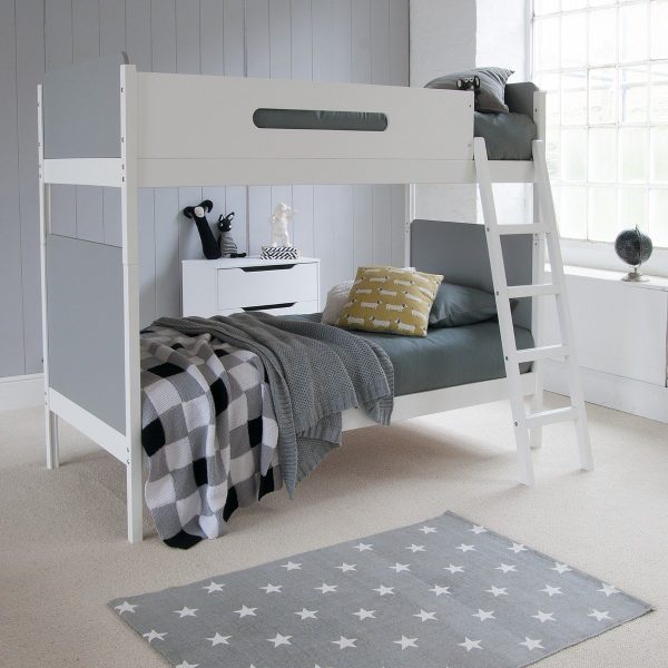Grey and white bunk bed that divides into two beds, against grey tongue and groove panelled wall.