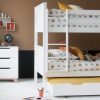 Beech bunk bed, fixed ladder and trundle for storage and sleepovers, next to trendy chest of drawers, with a mid century modern design