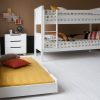 Trundle bed, separate to Classic Beech Bunk bed in white, with chest of drawers behind