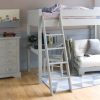 Light grey high sleeper bed with storage, desk, chair, futon and chest of drawers