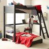 Child's vintage inspired dark blue loft bed with desk and unfolded futon underneath.