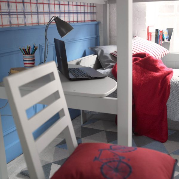 Close up of a child's corner desk in light grey