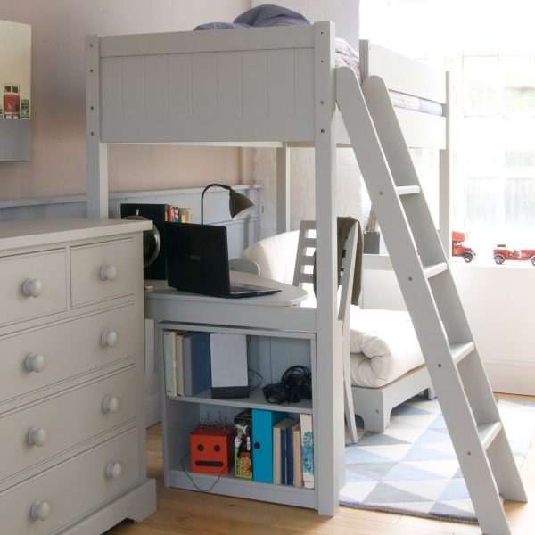 Side view of grey high sleeper bed with corner desk, child's futon bed and chest of drawers