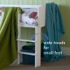 Fixed ladder with wide treads for easy climbing, on the mid sleeper cabin bed in white.