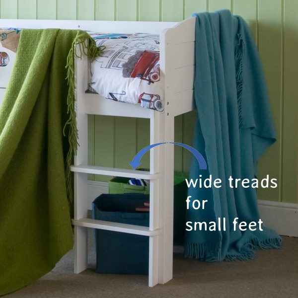 Fixed ladder with wide treads for easy climbing, on the mid sleeper cabin bed in white.