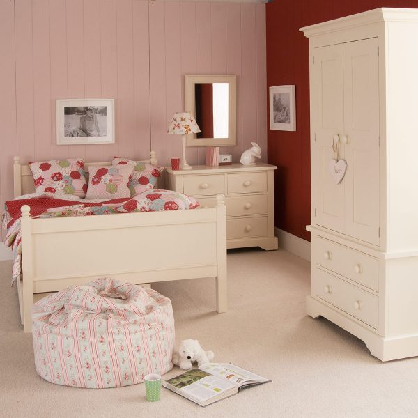Fargo small double bed in Ivory White, in pink and red girls bedroom with a chest of drawers and wardrobe.
