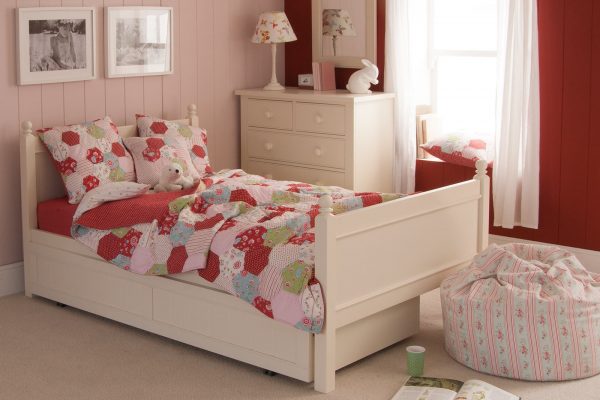 Classic Ivory White Fargo small double bed for kids, with integrated pull out trundle in pink girls bedroom.