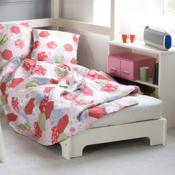 sleepover futon chair bed unfolded in child's room.