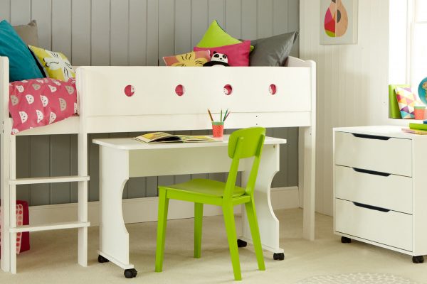 White sturdy mid sleeper cabin bed for kids, with roll out desk and roll out chest of drawers.