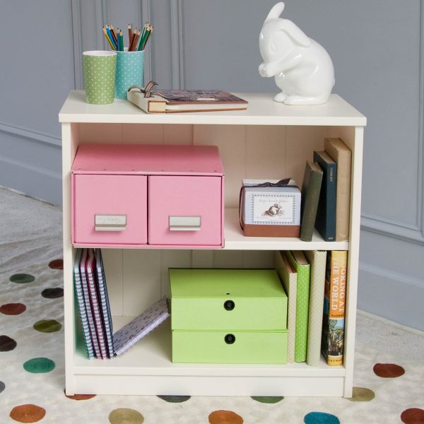 Bookcase with adjustable shelf and white bunny on top