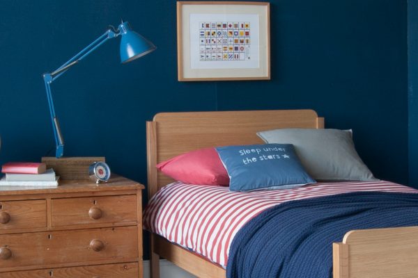Close up Edit single bed in oak, with solid hardwood bedframe and oak effect panels.