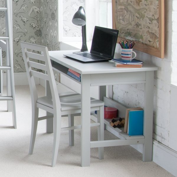 Child's study desk with storage + chair in dinosaur themed bedroom for boys