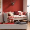 Farleigh Grey daybed with tartan plaid, red wall, pull out trundle and chest of drawers
