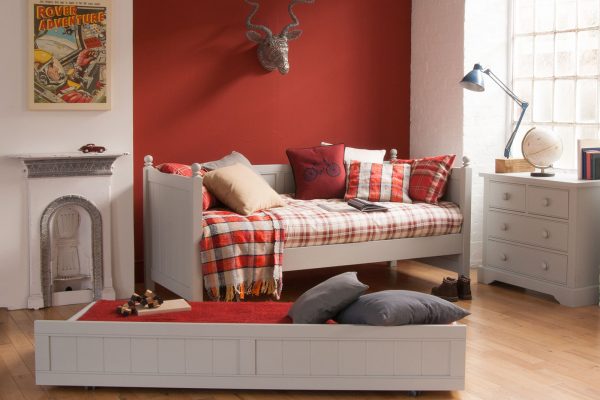 Farleigh Grey daybed with tartan plaid, red wall, pull out trundle and chest of drawers
