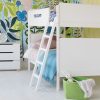 Plain white kids bunk bed with modern rounded edges, lean to ladder, and large scale tropical wall mural