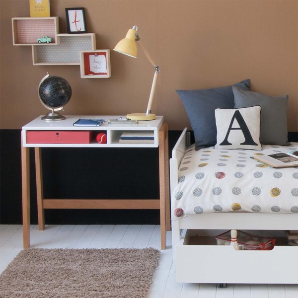Edit desk with solid beech legs, next to white kids bed in gender neutral bedroom