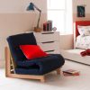 navy futon with red buttons, red cushion and beech frame