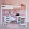 white loft bed in girls room. Study desk, chest of drawers and storage - saving space under the bed