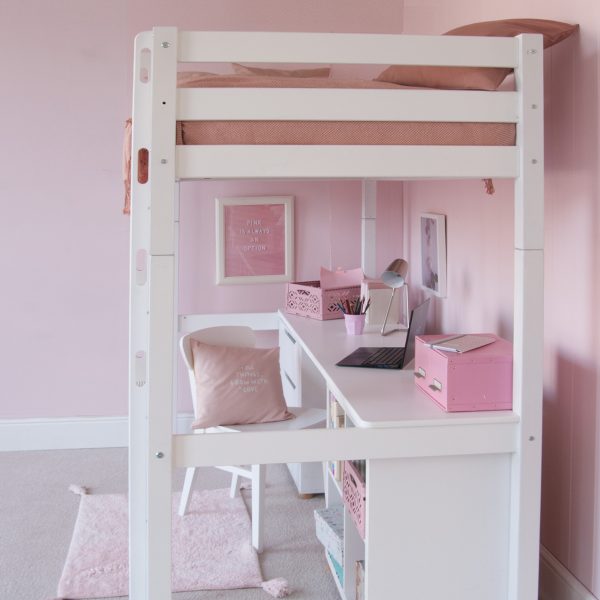 side view of high sleeper bed in girls bedroom, White chair, white desk, in pink and white bedroom