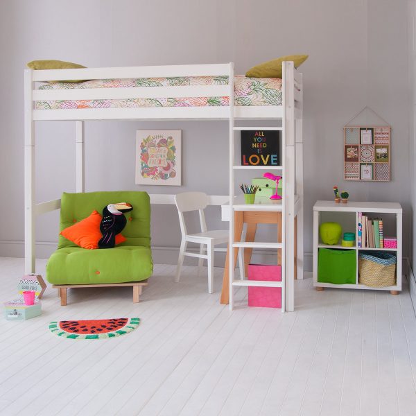 White loft bed dressed in bright colours with desk, storage and futon chair underneath