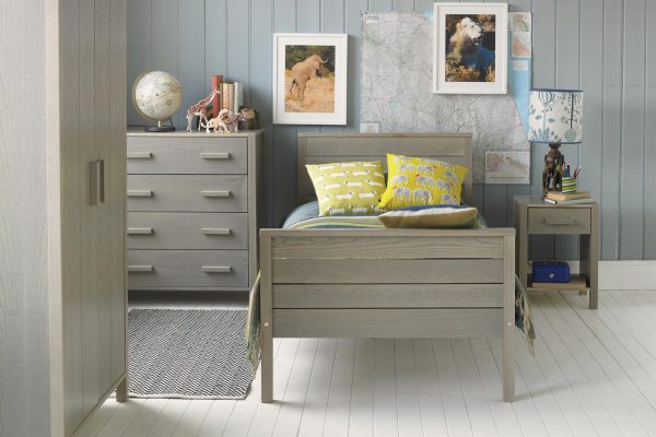 Grey wash Ash Woodland bed with wardrobe, chest of drawers and a bedside table, with a global travel theme.